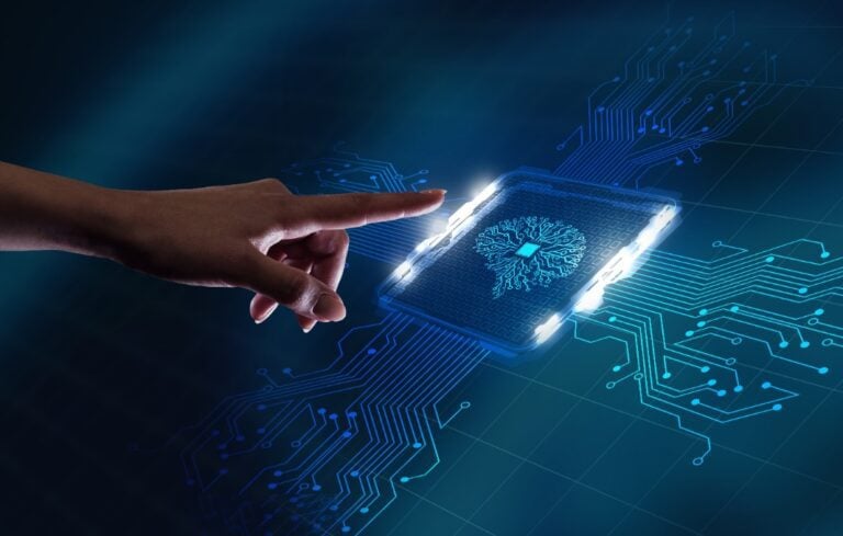 Hand reaching out to computer circuit